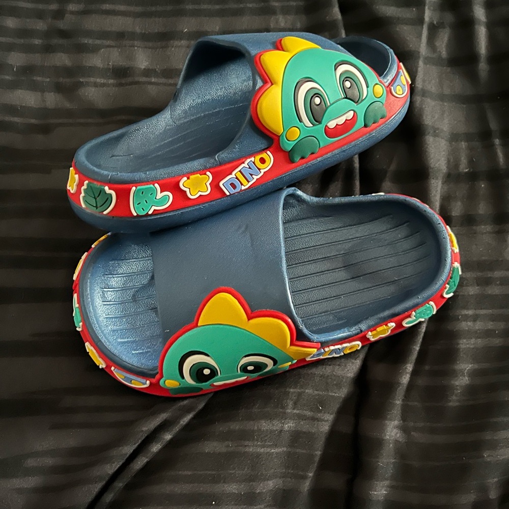 Unisex Dino slides blue with multi colors size 7.5 toddler